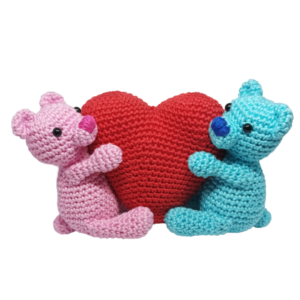 crochet teddies holding a heart